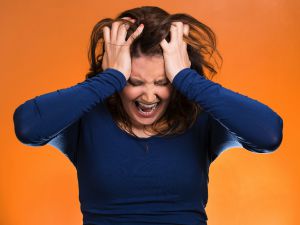 Stressed woman pulling hair SMALL